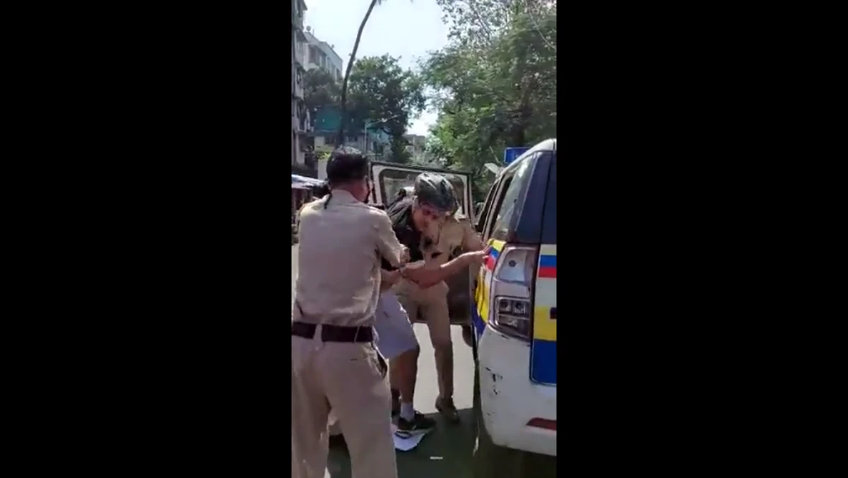 Mumbai police manhandle local for questioning cutting of 100-year-old tree | Watch