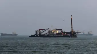 Cargo ship hit, catches fire in Strait of Hormuz; two casualties reported