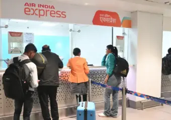 Gun fires during airport check, injuring two security staff
