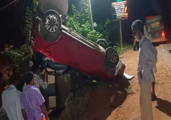 Family of four escapes major injury as car overturns in Dharmasthala