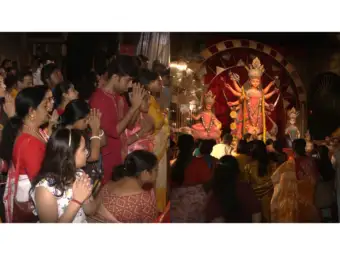 Devotees participate in sacred Maha Ashtami Pushpanjali at Kolkata's Kendua Shanti Sangha Durga Puja pandal