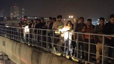 Watch | Commuters walk on tracks as power outage halts Gurugram Rapid Metro