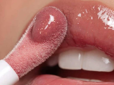 9 Plumping Lip Glosses That Never Feel Sticky Or Tacky