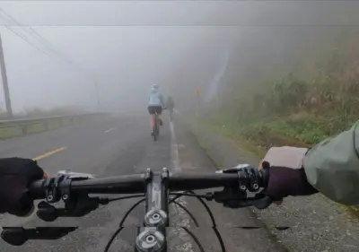 Man on bicycle rides through monsoon downpour in Ahmedabad