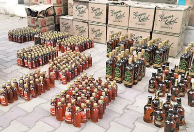 Bodakdev police seize Rs 1.9L premium booze; bootlegger escapes raidRecover 73 bottles from Activa, residence during raid; accused linked to 8 more cases