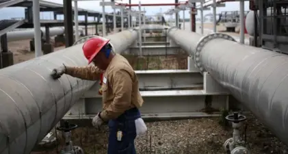 Crude oil prices fall below $100 a barrel