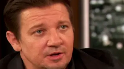 'It Was A Great Gig': Jeremy Renner Offers Drew Barrymore Lipstick Advice While Recalling Working At Department Store