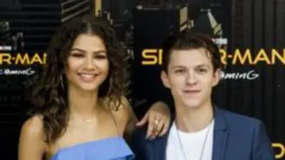 Tom Holland Adjusts Zendaya's Outfit At LA Event, Fans React