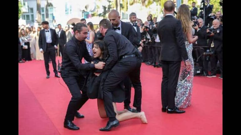 Woman strips on Cannes red carpet to protest against rape cases in Ukraine