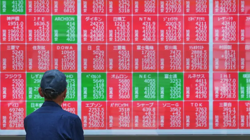 Asian shares mostly higher, tracking Wall Street's fresh records, oil prices fall
