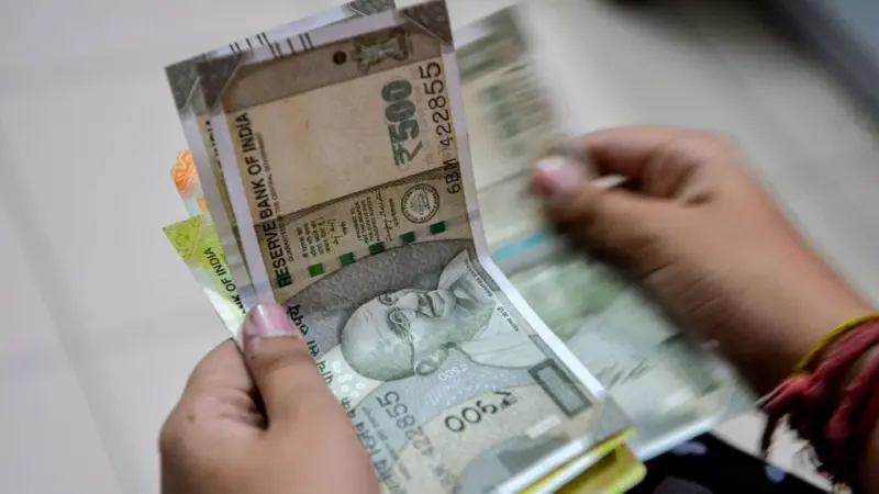 USD vs INR: Indian Rupee jumps 1.6% to 93.19 per dollar after RBI curbs net open positions. Where's it headed?