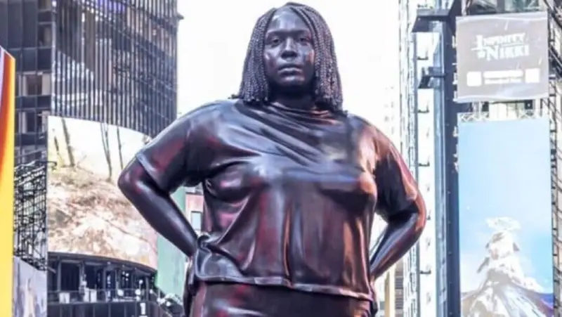 GIANT 12-feet bronze statue of black woman installed in New York's Times Square. It's called 'Grounded in the Stars'