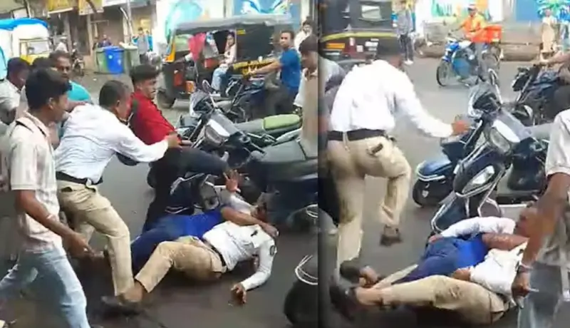 वाहतूक पोलिसांना जमिनीवर पाडून लाथाबुक्यांनी मारहाण.