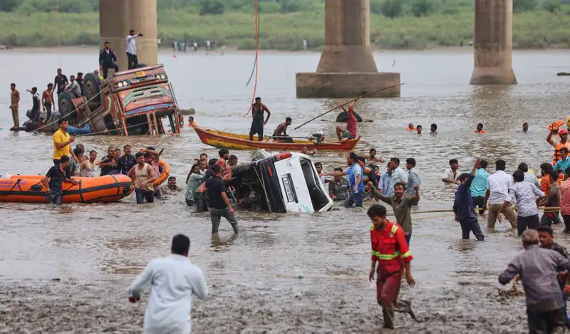 Nine killed as vehicles fall into river after bridge collapse in Vadodara