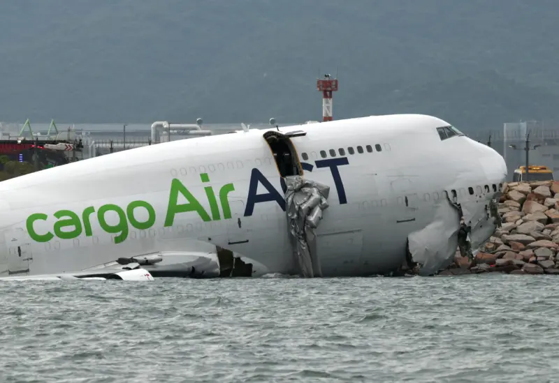 Cargo aircraft skids off Hong Kong airport runway into sea, 2 dead