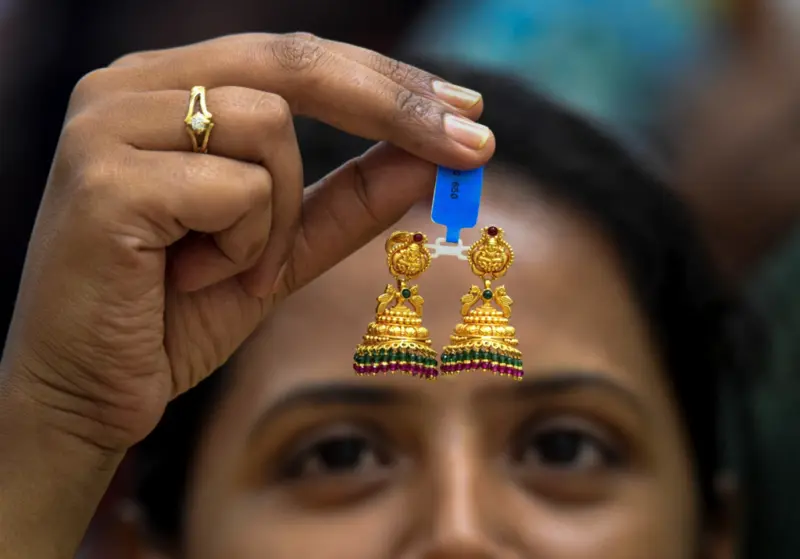 Gold futures slide to Rs 1.50 lakh/10g as oil surge, dollar weigh on bullion