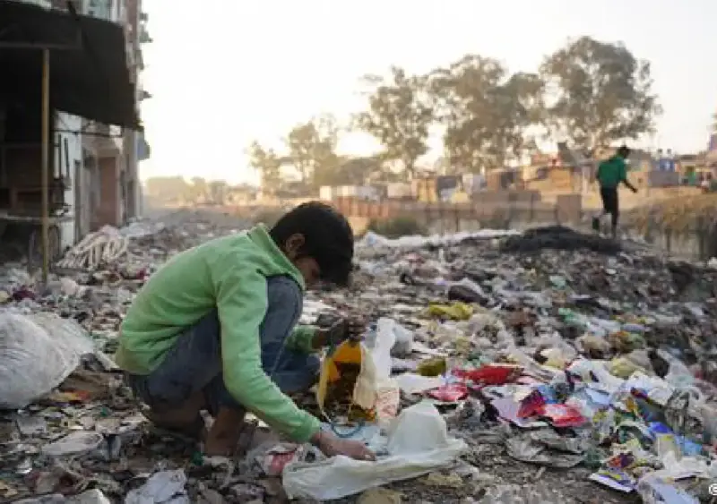 Young boys risk danger collecting scrap metal to support families