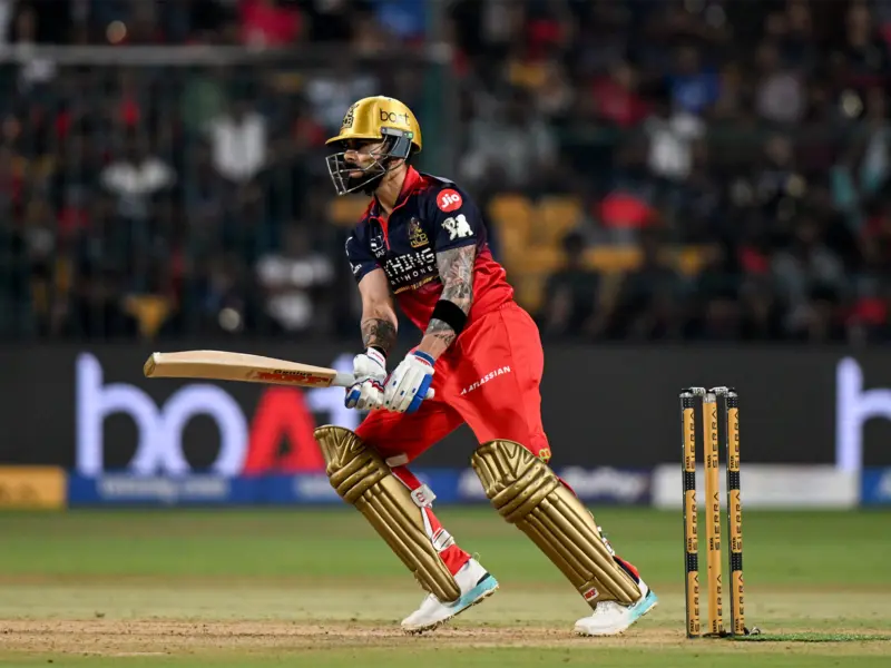 Virat Kohli scores 49 despite knee issue as RCB top IPL table