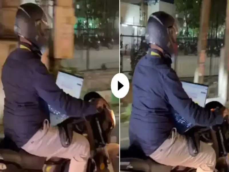 OMG! A man performs office work while riding his bike, leaving netizens astonished
