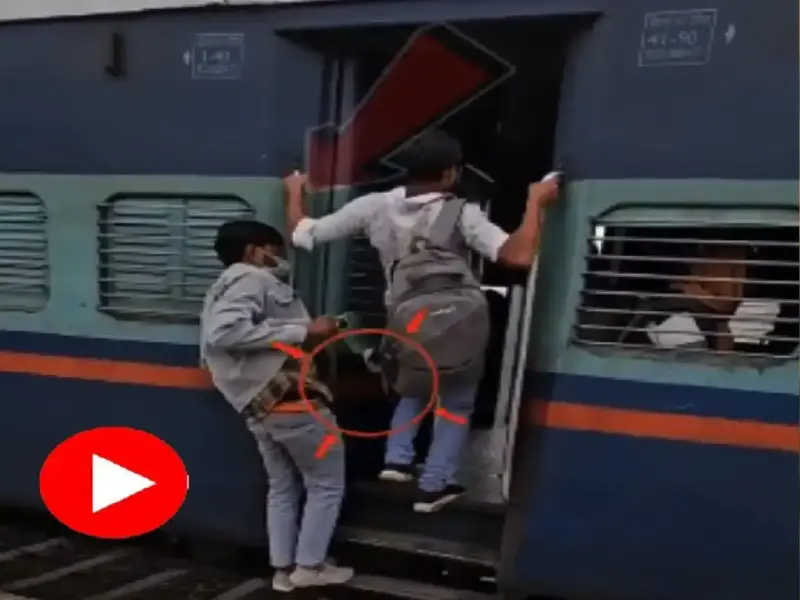 A thief steals a mobile phone from a young man's pocket as he boards a train with such finesse! Video of the pickpocket goes viral